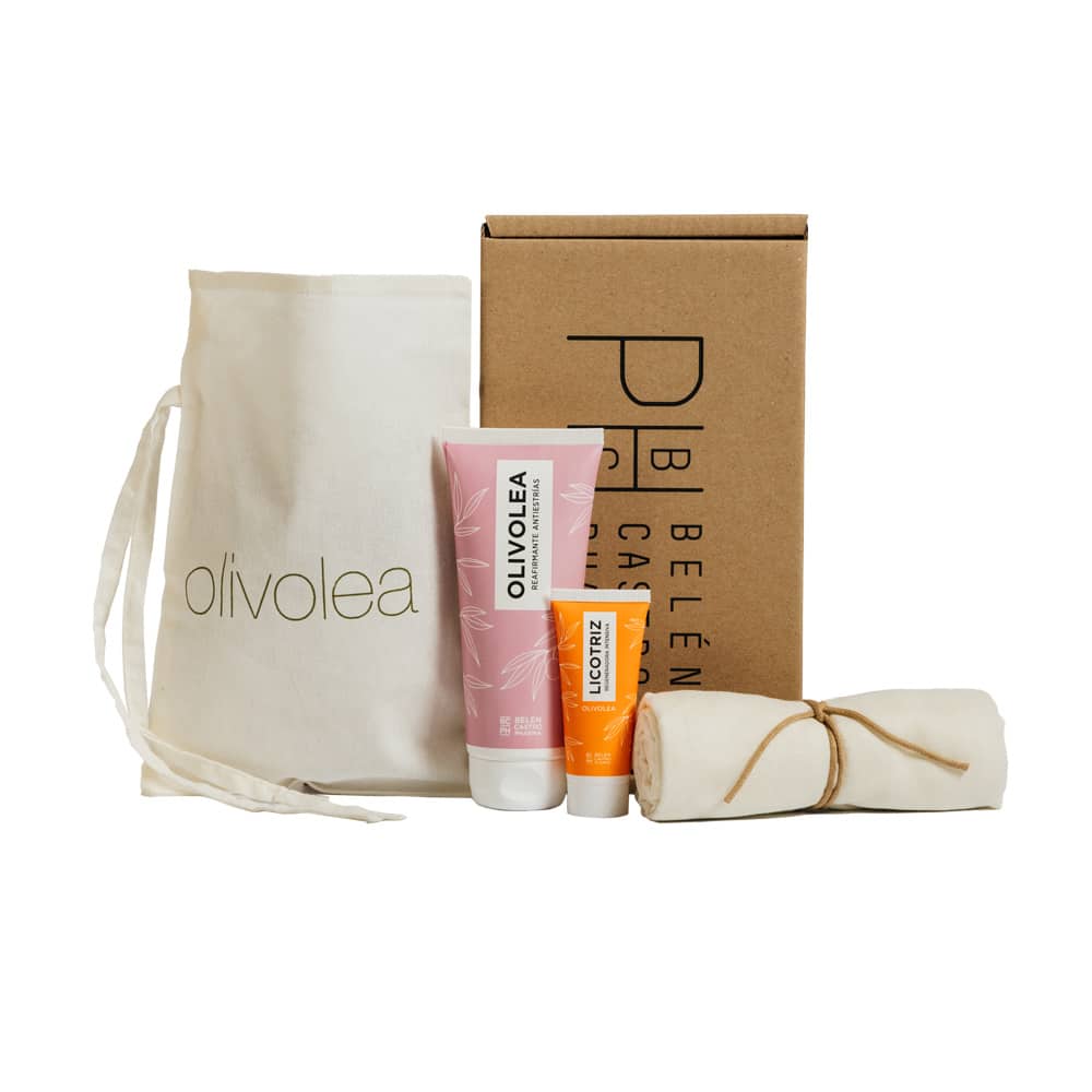 Set de productos Olivolea con bolsa de tela, crema regeneradora y loción Licotriz, junto a caja de presentación y paño enrollado